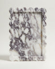 Marble-patterned rectangular marble tray on a white background