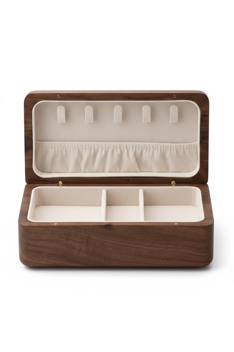 A rectangular wooden jewelry box shown open, featuring a dark brown wood exterior and a cream-colored interior with five hanging loops on the lid and three compartments in the base.