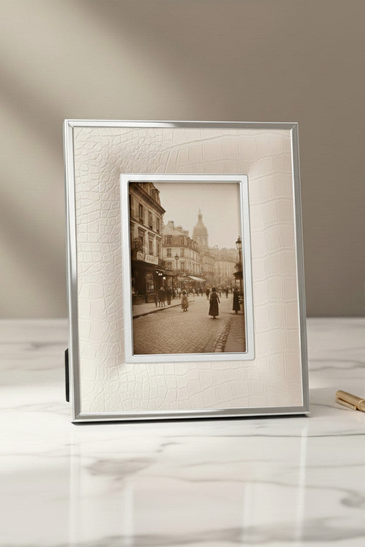  white luxury picture frame photograph of a city street scene on a marble surface with a neutral background