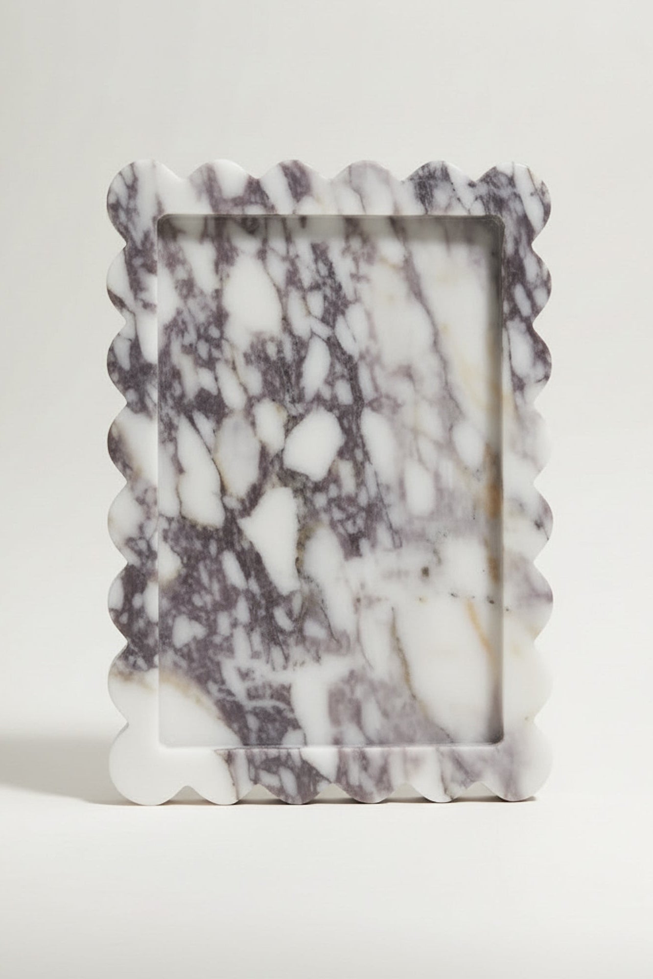 Marble-patterned rectangular marble tray  on a white background