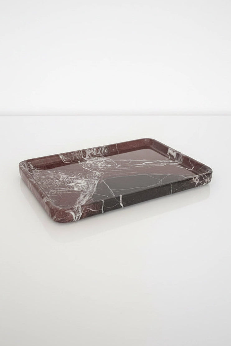 A rectangular marble tray with a dark reddish-brown base and white veining, photographed on a clean white background.